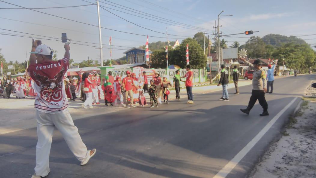 Polsek Bukit Batu Amankan Jalan Sehat HUT RI ke-80 di Banturung